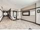 Inviting lobby area with stylish tiled floors, seating, large mirrors and modern decor accents at 1441 Central # 305, Denver, CO 80211