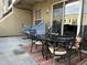 Relaxing patio with hammock, outdoor dining table, and sliding glass door access at 1441 Central # 305, Denver, CO 80211