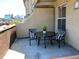 Charming patio area with table and chairs, offering a cozy outdoor seating space with a distant city view at 1441 Central # 305, Denver, CO 80211