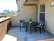 A patio with a table and two chairs at 1441 Central # 305, Denver, CO 80211