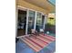 Cozy balcony featuring outdoor seating, a colorful rug, and sliding glass doors, perfect for enjoying the outdoors at 1441 Central # 305, Denver, CO 80211