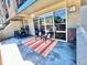 A patio with an outdoor rug and table with chairs, perfect for entertaining at 1441 Central # 305, Denver, CO 80211