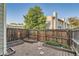 Private backyard with a wooden fence, custom garden boxes, a rock ground cover and a walkway at 8717 Carr Loop, Arvada, CO 80005