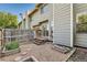 Backyard space featuring a wood deck and garden with custom boxes and walkway at 8717 Carr Loop, Arvada, CO 80005