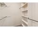 Open walk-in closet with shelving and rods for optimal storage at 8717 Carr Loop, Arvada, CO 80005