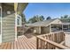 Spacious wood deck with view of the car port and common areas at 8717 Carr Loop, Arvada, CO 80005