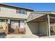 Exterior view of home featuring a covered car port and front entrance at 8717 Carr Loop, Arvada, CO 80005