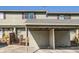 Exterior view of the town home featuring a covered car port with street view at 8717 Carr Loop, Arvada, CO 80005