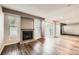 Spacious living room featuring a fireplace, wood floors, and a sliding glass door at 8717 Carr Loop, Arvada, CO 80005