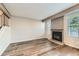Spacious living room featuring a fireplace, wood floors, and natural light at 8717 Carr Loop, Arvada, CO 80005
