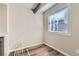 Bright room with window, light wood floors, and electrical outlets at 8717 Carr Loop, Arvada, CO 80005