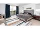 Bright bedroom with a large sliding door to a balcony and a stylish modern rug at 43 S Oneida Ct, Denver, CO 80230