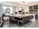 Modern kitchen featuring a spacious island with seating, stainless steel appliances, and designer finishes at 43 S Oneida Ct, Denver, CO 80230