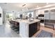 Spacious kitchen featuring a long island with seating and stainless steel appliances at 43 S Oneida Ct, Denver, CO 80230