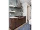 Contemporary kitchen design featuring open shelving and modern fixtures at 43 S Oneida Ct, Denver, CO 80230