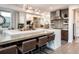 Bright kitchen with a large center island, modern pendant lighting, and bar seating at 43 S Oneida Ct, Denver, CO 80230