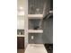 Elegant kitchen with floating shelves and stylish decorative items at 43 S Oneida Ct, Denver, CO 80230
