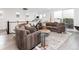 Open-concept living room featuring comfortable sofa, contemporary decor, and natural light at 43 S Oneida Ct, Denver, CO 80230
