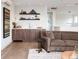Stylish wet bar and modern decor adjacent to a cozy living space at 43 S Oneida Ct, Denver, CO 80230