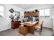 Bright home office featuring custom wood cabinetry and large desktop work space at 43 S Oneida Ct, Denver, CO 80230