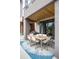 Covered outdoor patio with a large dining table, perfect for enjoying meals while overlooking the scenic view at 43 S Oneida Ct, Denver, CO 80230