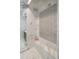 Elegant shower with a built-in bench and stylish tile work at 43 S Oneida Ct, Denver, CO 80230