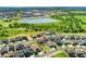 Aerial view of a residential neighborhood with a pond in the background at 10993 Ledges Rd, Parker, CO 80134