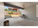 Covered back patio with a grill, offering an ideal space for outdoor cooking and relaxing at 10993 Ledges Rd, Parker, CO 80134