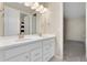 Bright bathroom showcasing a double sink vanity with white cabinetry and brushed gold hardware at 10993 Ledges Rd, Parker, CO 80134