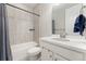 Small bathroom with a shower/tub combo and white vanity at 10993 Ledges Rd, Parker, CO 80134