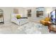 Bright bedroom with a plush carpet, large windows and a cozy sitting area at 10993 Ledges Rd, Parker, CO 80134