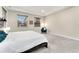 King-size bed and teal accent chair in a spacious bedroom at 10993 Ledges Rd, Parker, CO 80134