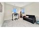 Small bedroom with a desk, chair, and a sofa at 10993 Ledges Rd, Parker, CO 80134