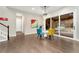 Dining area with hardwood floors, glass table, and sliding glass doors at 10993 Ledges Rd, Parker, CO 80134