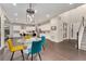 Dining area with hardwood floors, glass table, and access to the patio at 10993 Ledges Rd, Parker, CO 80134