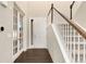 Bright entryway with hardwood floors, staircase, and french doors at 10993 Ledges Rd, Parker, CO 80134