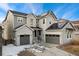 Two-story house with gray siding, stone accents, and solar panels at 10993 Ledges Rd, Parker, CO 80134