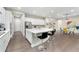 Modern kitchen with white cabinets, large island, and stainless steel appliances at 10993 Ledges Rd, Parker, CO 80134