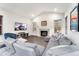 Spacious living room with a gas fireplace and large sectional sofa at 10993 Ledges Rd, Parker, CO 80134
