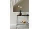 Stylish bar cart with glassware and decorative items at 1818 S Quebec Way # 3-4, Denver, CO 80231