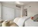 Comfortable bedroom with neutral tones, closets, and a large window allowing for natural light at 1818 S Quebec Way # 3-4, Denver, CO 80231
