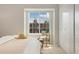Bright bedroom featuring a cozy bed, large window with neighborhood view, and ample closet space at 1818 S Quebec Way # 3-4, Denver, CO 80231