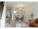 Bright dining area features a table with four chairs, and a view into the kitchen at 1818 S Quebec Way # 3-4, Denver, CO 80231