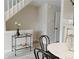 Open dining area with sleek bar cart, modern decorations, and hardwood floors at 1818 S Quebec Way # 3-4, Denver, CO 80231