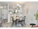Dining area featuring a modern table with black chairs and stylish lighting at 1818 S Quebec Way # 3-4, Denver, CO 80231
