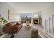 Well-decorated living room with brick fireplace, large sofa, and large window at 1818 S Quebec Way # 3-4, Denver, CO 80231