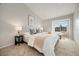 Bright main bedroom with vaulted ceiling, large window, and neutral decor at 1818 S Quebec Way # 3-4, Denver, CO 80231