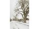 Wintery road view in neighborhood featuring snow covered ground and bare trees at 1818 S Quebec Way # 3-4, Denver, CO 80231