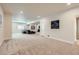 Expansive basement featuring plush carpeting, recessed lighting, comfortable seating, and natural light at 12578 Hudson Ct, Thornton, CO 80241