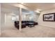 Finished basement offering a spacious living area with plush carpeting, recessed lighting, and comfortable seating at 12578 Hudson Ct, Thornton, CO 80241